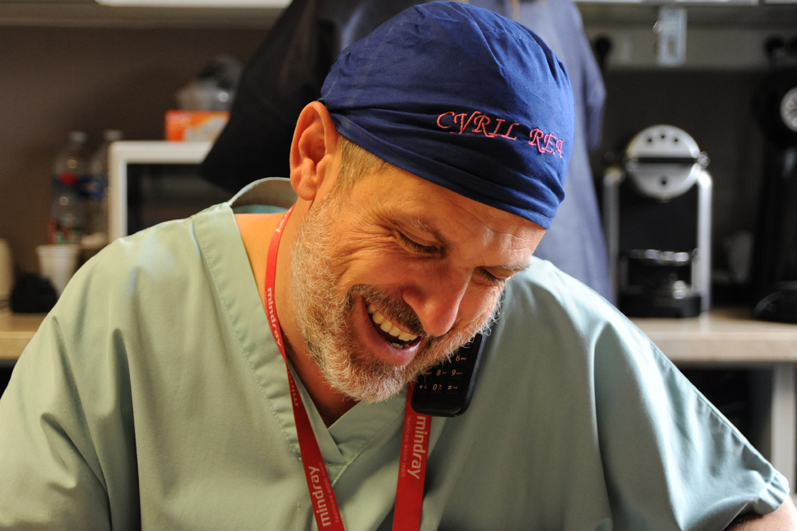 Cyril Goulenok on the phone in the Intensive Care Medicine department